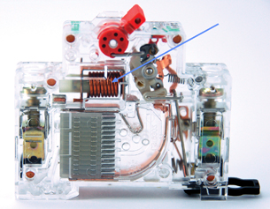 A photo shows the inner working of a circuit breaker with an arrow indicating the location of the solenoid.
