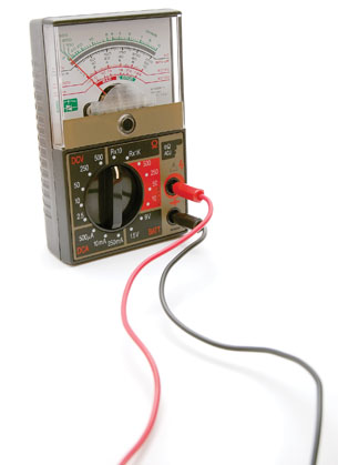 A photograph shows a multimeter, which can measure the current, or amount of charge per second, flowing through a conductor.