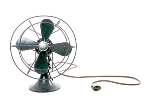 A photo of an electric fan is shown. Its motor operates on the electromagnetic force created by moving current in a perpendicular magnetic field.