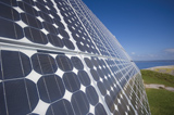 A close-up image of a solar cell as part of a series of solar panels, which are used to capture the energy from electromagnetic radiation.