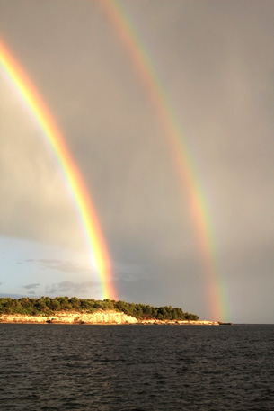 The rainbow in this photo is a natural example of a spectrum.