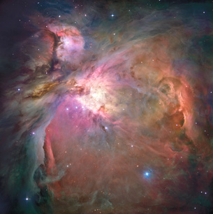 A photograph shows light from the Orion Nebula; it is a mosaic of colour.
