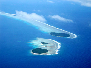 A photo shows two islands in a vast sea. Water covers most of Earth’s surface.