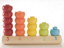 This photo shows a brightly coloured peg and ring toy.