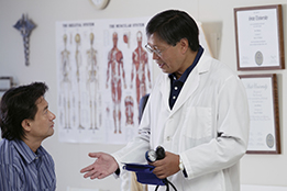 This is a photo of a doctor counselling a patient about blood pressure.