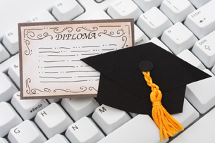 A photograph shows several students sitting in front of computers.