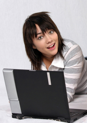 Teenage girl working on a laptop