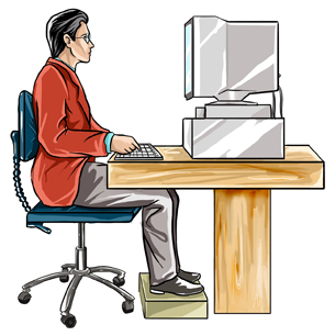 Image of a man sitting at a computer workstation.