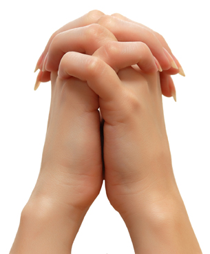 a photograph of two hands firmly pressed together with fingers interlaced