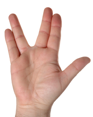 a photograph of the thumb and index finger of one hand spreading two fingers on the other hand as much as possible