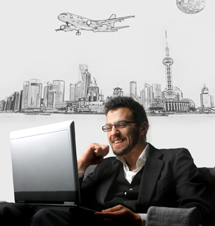 This photograph shows a businessman with a laptop against a city backdrop.