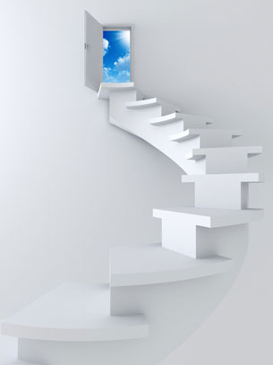 A set of steps up to an open doorway with blue sky.