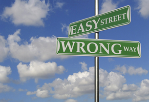 A street sign depicting easy street and wrong way.