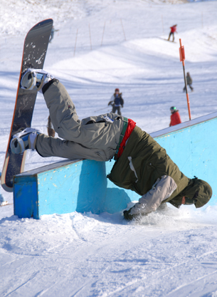 A snow boarder that has wiped out.