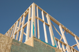 This photograph shows the upper frame of a house under construction.