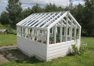 This photograph shows a garden greenhouse.