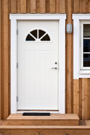 This graphic shows a semicircular window in an exterior door of a house.