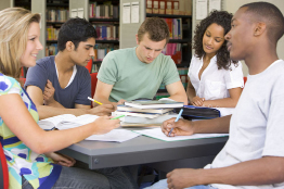 A photo shows five students studying together in a library.