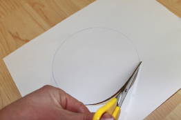 This photo shows the traced circle being cut out.