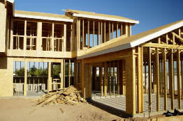 This photo shows a house and attached garage under construction.