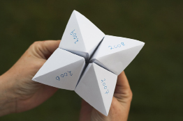 This photo shows a “Fortune Teller” game that is played with folded paper.