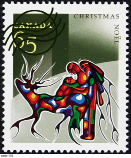 This is an image of a 2002 Christmas-issue stamp celebrating Aboriginal art in Canada.