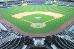 These photos show a baseball diamond and a close up of one of the bases.
