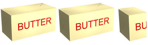 This photo shows two one-pound sticks of butter and two-fifths of a stick of butter. The total mass of the butter is one kilogram.