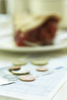 An image shows money left on a table as a tip in a restaurant.