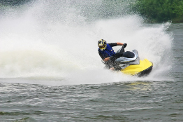 This is a photo of a person riding a personal water craft.