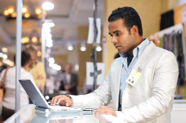 This is a photo of a salesperson in a clothing store.