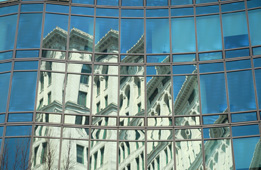 This picture shows the reflection of a building in an office tower.