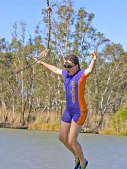 This is a photo of a person falling from a rope into the water.