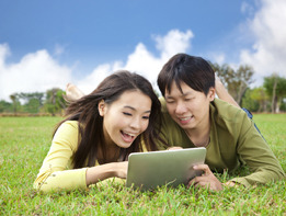 This is a photo of two students using a tablet computer.